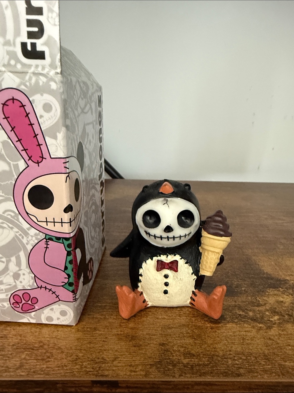 Funko Black and Cream Penguin Skeleton Figurine with Orange Accents